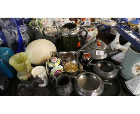 A Tray of Curios to Include Pewter Three Piece Tea Service, Ostrich Egg, Silver Plate, Dog Ornament, Onyx Vase, Engraved Glas