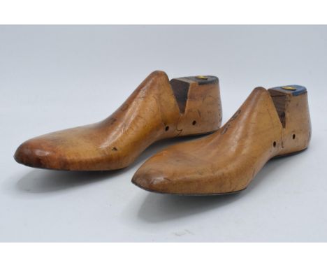 A pair of vintage wooden and metal cobblers shoe moulds (2). 30cm long.  
