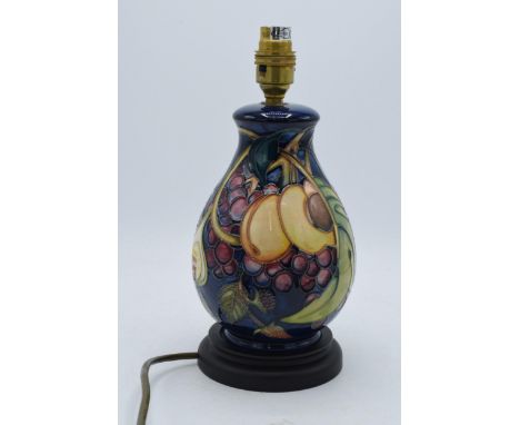 Moorcroft table lamp base (Shape 7/7) in the Queens Choice pattern by Emma Bossons, baluster form on a wooden base, 26cm tall
