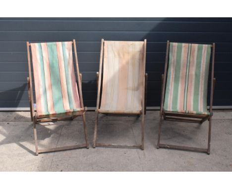 A trio of vintage 20th century wooden and fabric folding deck chairs (3).  Age-related wear and use etc, cloths faded, old wo