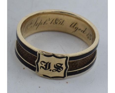 Gold and enamel mourning ring, inscribed 1851 with hair decoration, gross weight 4.0 grams. Size R.  