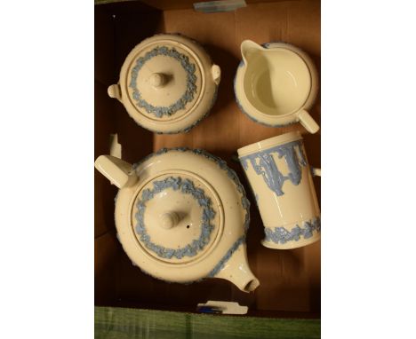 Wedgwood blue and white Queensware items to include a teapot, lidded sugar, milk jug and creamer (4) (all with damages).  Tea