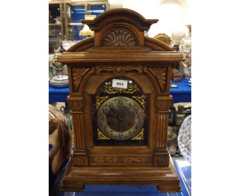 A wooden Victorian mantle clock with silver chapter ring and Arabic numerals Condition Report: Available upon request