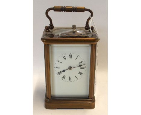 A brass and glass carriage clock, the white dial with Roman numerals Condition Report: , No sign of life, but no damage .