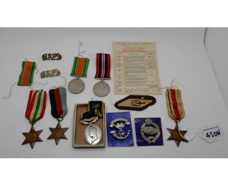 A lot comprising a WWII group of five, a tank brigade badge and patch and a territorial efficiency medal to 896963 Tpr F H Da