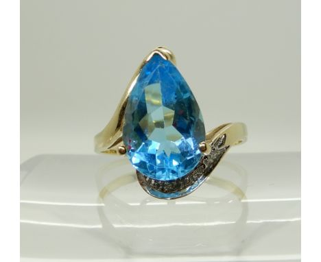 A 9ct gold blue topaz and diamond accent ring, size T1/2, weight 3.7gms Condition Report: Available upon request