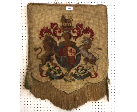 A bead and tapestry shield shaped panel depicting the Arms of Great Britain flanked either side with a lion and unicorn Condi