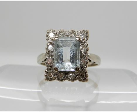 An 18ct white gold diamond and aquamarine set ring, size of aqua 8mm x 6mm x 4.3mm, diamonds estimated approx combined 0.18ct