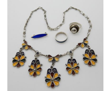 A Norwegian silver and enamel brooch by Marius Hammer, a silver and enamel ring by David Andersen, a silver retro ring by Dan
