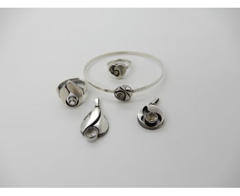 Three Finnish design items signed Sten &amp; Laine to include two pendants and a bangle and two further rings in the style of