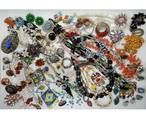 A glass cherry necklace, First Nation beadwork, a Miracle necklace, carved lucite brooch and other items Condition Report: No