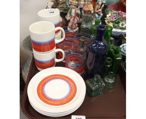 Poole pottery plates, mugs and matching glasses together with assorted glass bottles Condition Report: Available upon request