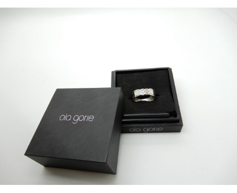 An Ola Gorie silver Celtic knotwork ring Condition Report: Not available for this lot