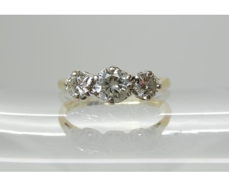 An 18ct gold three stone diamond ring set with estimated approx 0.65cts of brilliant cut diamonds, size K, weight 2.4gms Cond