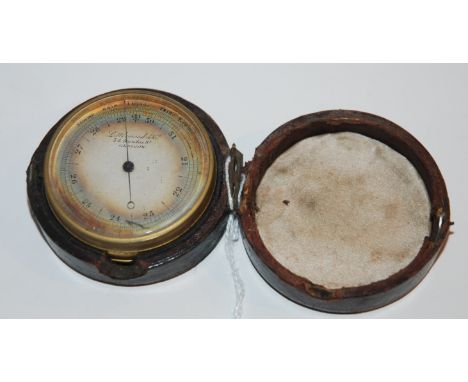 A brass cased pocket barometer by Littlewood &amp; Co, Glasgow, 5cm diameter in case Condition Report: Available upon request