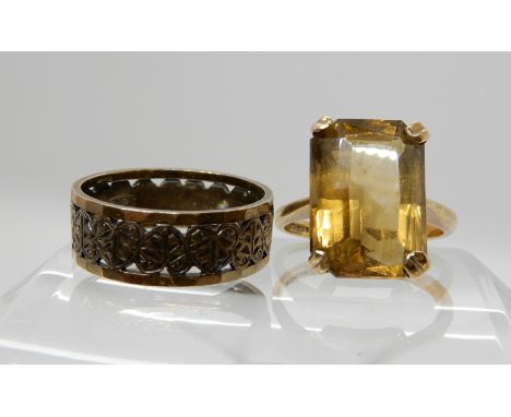 A 9ct gold citrine set ring, size M and a 9ct gold heart design wedding ring size O, combined weight 7.1gms Condition Report: