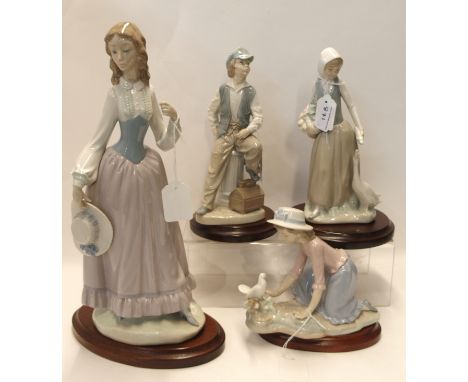 A large Lladro figure of a lady (missing parasol) and three Nao figures Condition Report: Available upon request