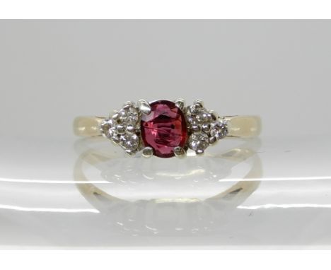 A 9ct gold ruby and diamond ring, size T, weight 2.4gms Condition Report: Available upon request