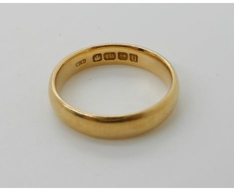 An 18ct gold court wedding ring, size S1/2, weight 6.6gms Condition Report: Available upon request