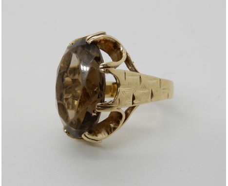 A 9ct gold retro smoky quartz ring, size K1/2, weight 5.5gms Condition Report: Available upon request