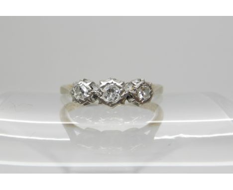 A 9ct gold three stone diamond ring in illusion setting, estimated approx diamond content 0.20cts, size N, weight 2.1gms Cond