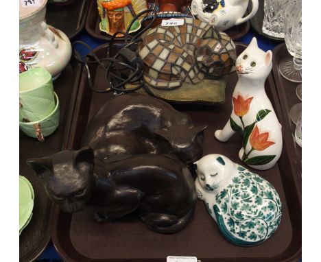 A Griselda Hill pottery cat, three other cat models and a leaded glass cat lamp Condition Report: Available upon request