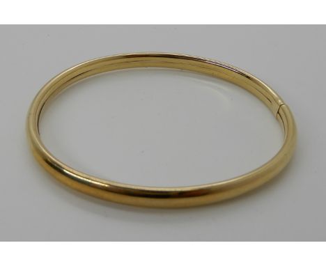 A 9ct gold bangle, inner diameter approx 5.9cm, weight 6.3gms Condition Report: Available upon request