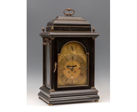 Bracket type table clock, late 17th-early 18th century.Box with wooden latticework and gilt brass ornaments.Highly engraved a