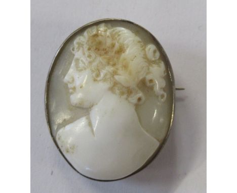 An oval cameo brooch, carved with a Classical portrait