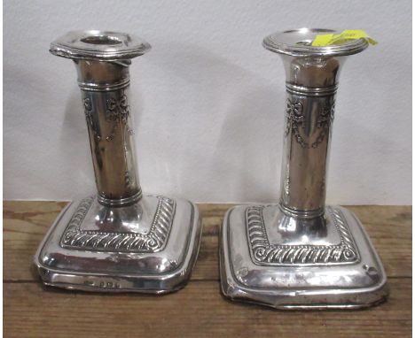 A pair of silver candlesticks, af