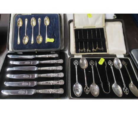 A cased set of silver handled tea knives, together with five silver tea spoons, a set of six silver cocktail sticks and a set