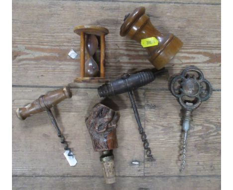 A collection of items, to include cork screws, a pepper mill and a Mauchline egg timer printed with a view of Salibury Cathed