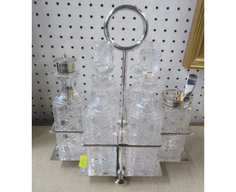 A silver plated cruet stand, fitted with six glass condiment pots