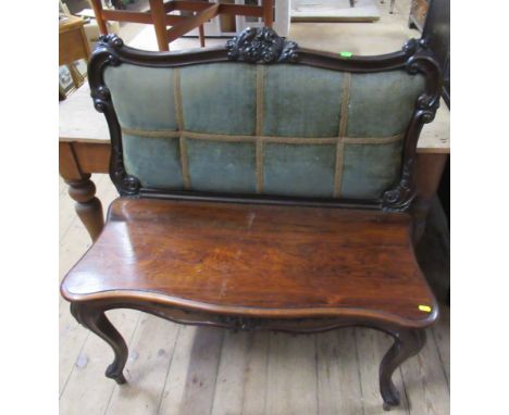 A 19th century rosewood bench seat, with upholstered back and carved decoration, height 40ins, width 37ins
