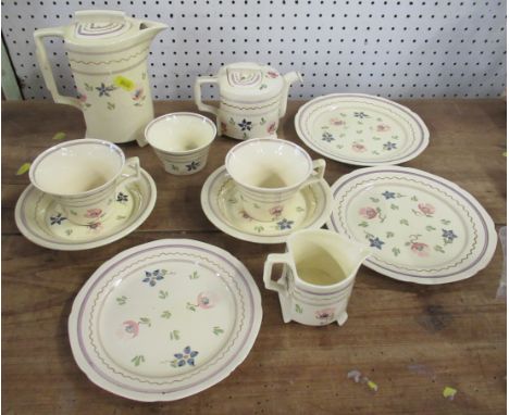 A Bristol pottery tete a tete, comprising tea pot, coffee pot, two cups and saucers, two side plates, another plate, jug and 