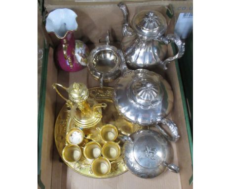 A silver plated tea set, a vase and a gold plated drinks set