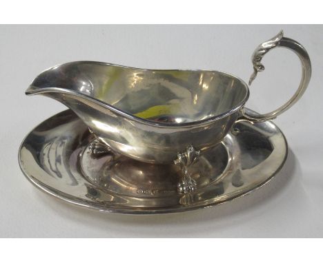 A silver sauce boat, and stand, weight 10oz