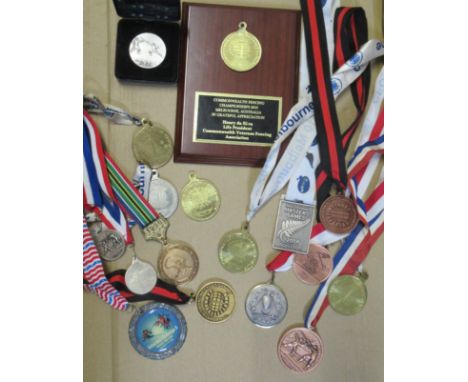 From the Henry De Silva Collection   A collection of medals to include:   1997: Commonwealth Veterans I.O.M. (40 mm dia.). 19