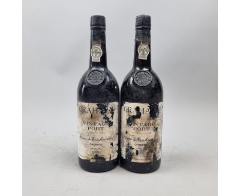 2 Bottles Graham's 1977 Vintage Port.   (Please note bin soiled/damaged labels. Fill level top shoulder/in neck)  