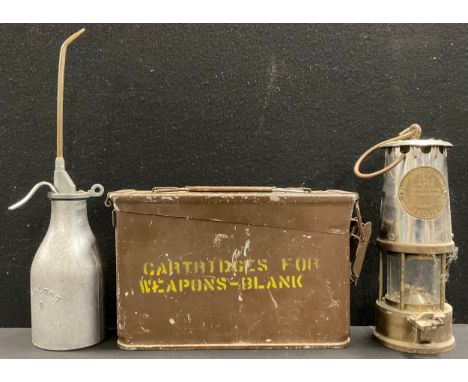A US Military cartridge case; an Eccles miner's lamp; an aluminium oil can (3)