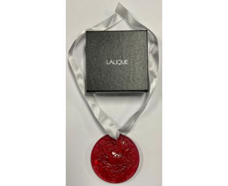 A Lalique ruby glass circular Christmas tree decoration, with ribbon, boxed