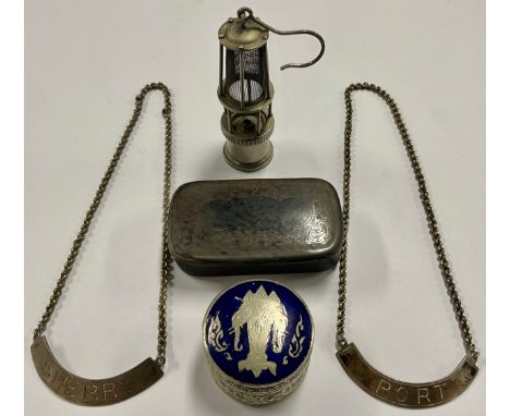 A miniature miner's lamp, 7.5cm high; a papier-mâché snuff box, 7cm x 4cm; a Thai pill box, with blue enamelled lid, depictin