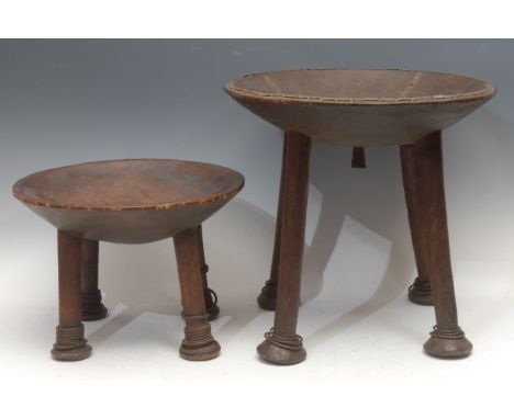 Tribal Art - a Kamba stool, dished circular top, copper mounted with geometric borders, outswept legs with loose rings, pad f