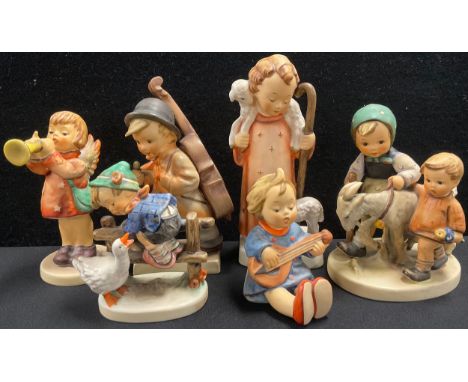 Six Goebel/Hummel figurines including ‘Homeward Bound’, 13cm high; ‘Good Shepard’, 16cm high; ‘Little Cellist’, 14.5cm high, 
