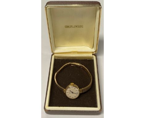 A Timor 9ct gold cased lady's wristwatch, cream dial, Arabic numerals, 17 jewel manual wind movement, 9ct gold textured brace