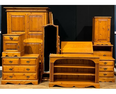 A pine wardrobe, 199cm high, 125cm wide, 61.5cm deep; a George III style pine bureau; a pine chest, of two short and two long