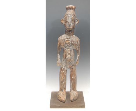 Tribal Art - a Mumuye figure, standing, geometric scarification to centre of torso, traces of white pigment, 56cm high, Niger
