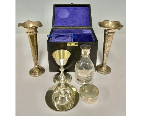 A pair of silver trumpet vases, weighted bases, Birmingham 1905, a silver plated travelling communion set inc chalice, plate,
