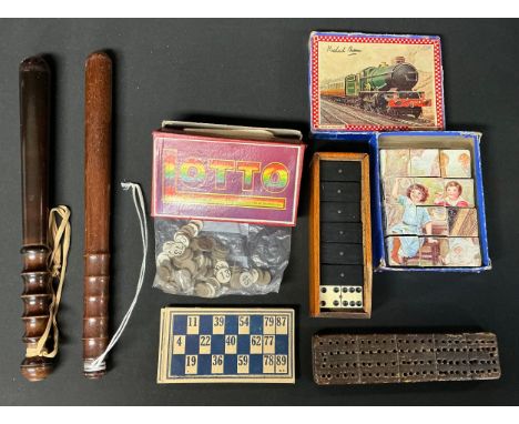 A set of bone and ebony dominoes, mahogany box, late 19th century; a cribbage board; a Lotto game; a Glevum Series block puzz