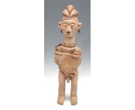 Tribal Art - a Yaka fetish figure, he stands, cloth bound and decorated with earth pigments, 54cm high, Democratic Republic o
